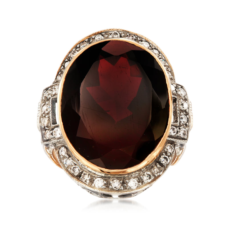 Oval garnet ring with brown diamond halo in sterling silver and yellow gold