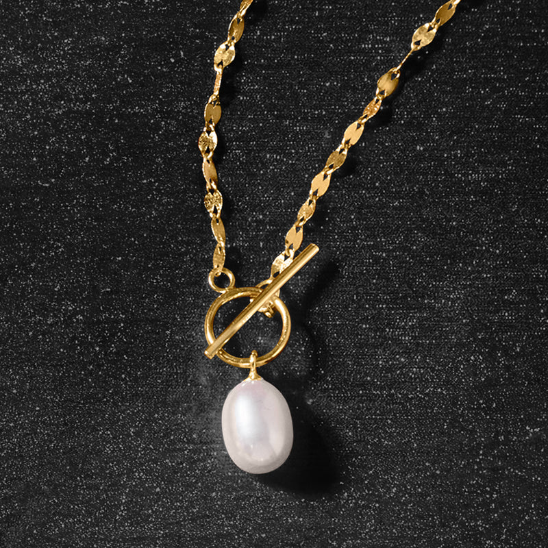 Yellow gold toggle pearl necklace with chain links and teardrop pearl pendant