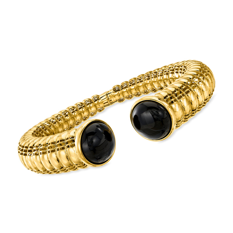 Twisted cuff bracelet with gold chain links and two black onyx-style cabochons