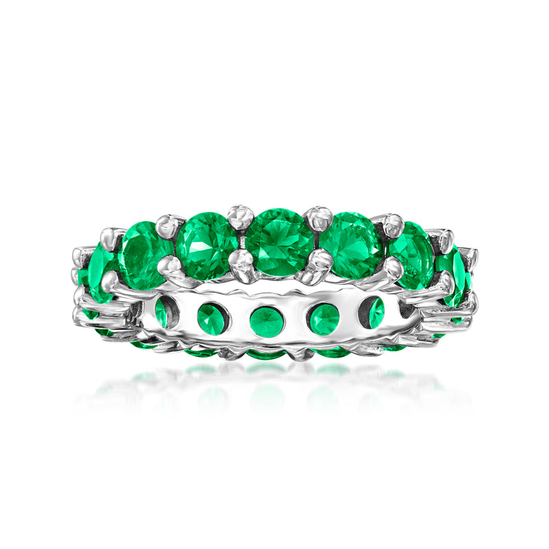 Sterling silver eternity band with green simulated emerald oval stones and round accents