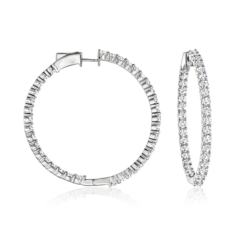 Diamond hoop earrings in 14kt white gold with inside-out pave, hinged closure