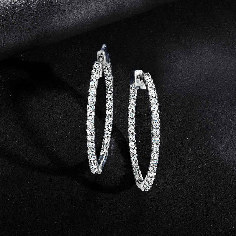 Sterling silver inside-out diamond hoop earrings, angled front view