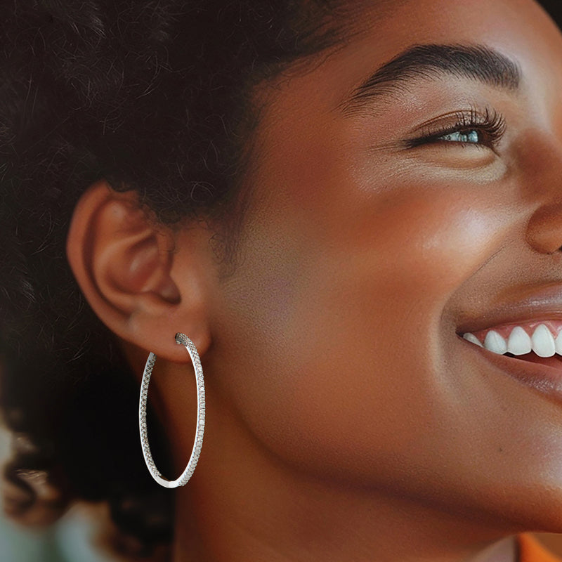 Diamond inside-outside hoop earring in sterling silver on model's ear