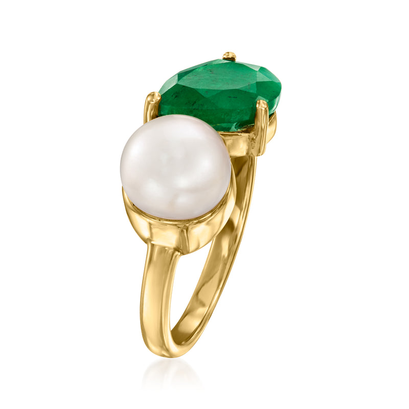 Gold Toi et Moi ring profile with white pearl and green emerald in raised prongs