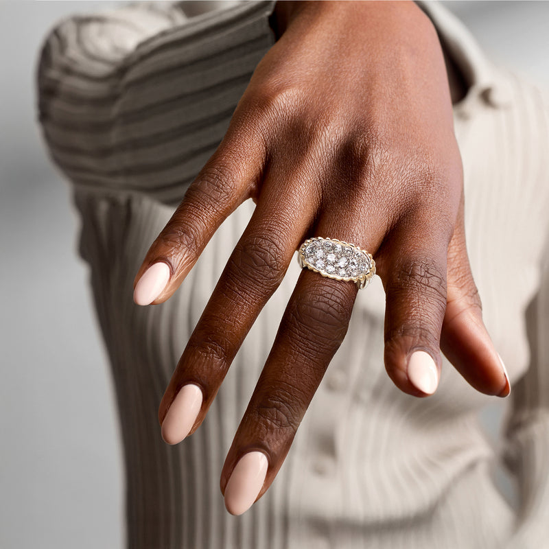 Diamond cluster fluted ring in 14kt yellow gold on finger, size 8