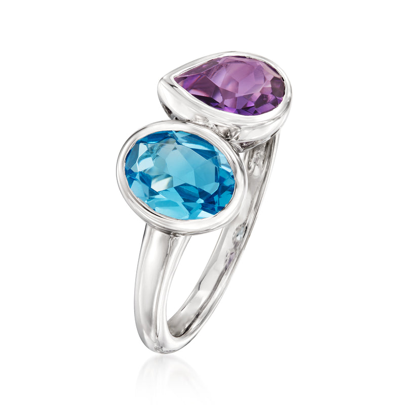 Sterling silver toi et moi ring shown from side, blue topaz and amethyst gemstones