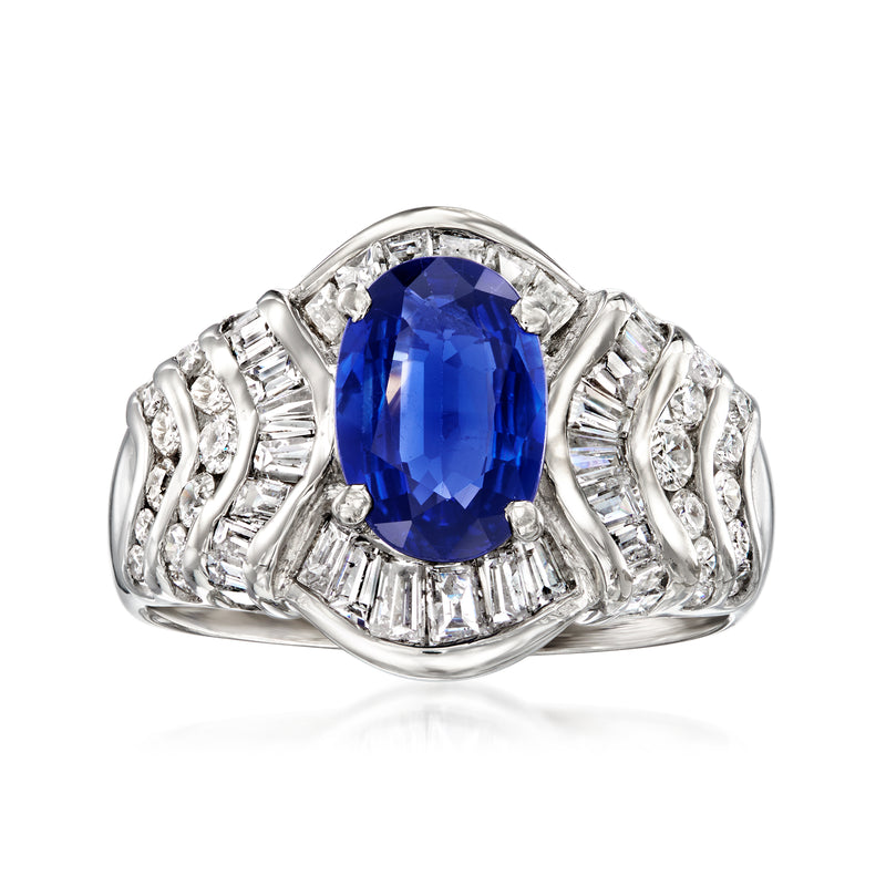 Platinum oval blue sapphire ring with diamond baguette side details
