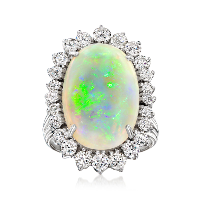 Oval opal cabochon ring with diamond halo in 14kt white gold setting