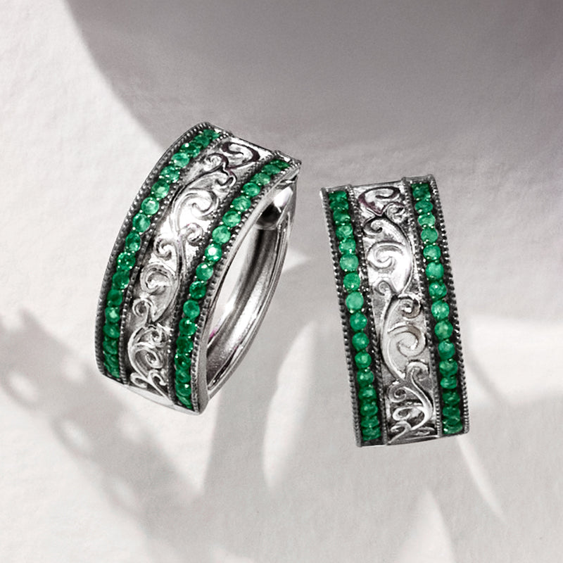 Sterling silver hoop earrings with engraved center and emerald green bead border