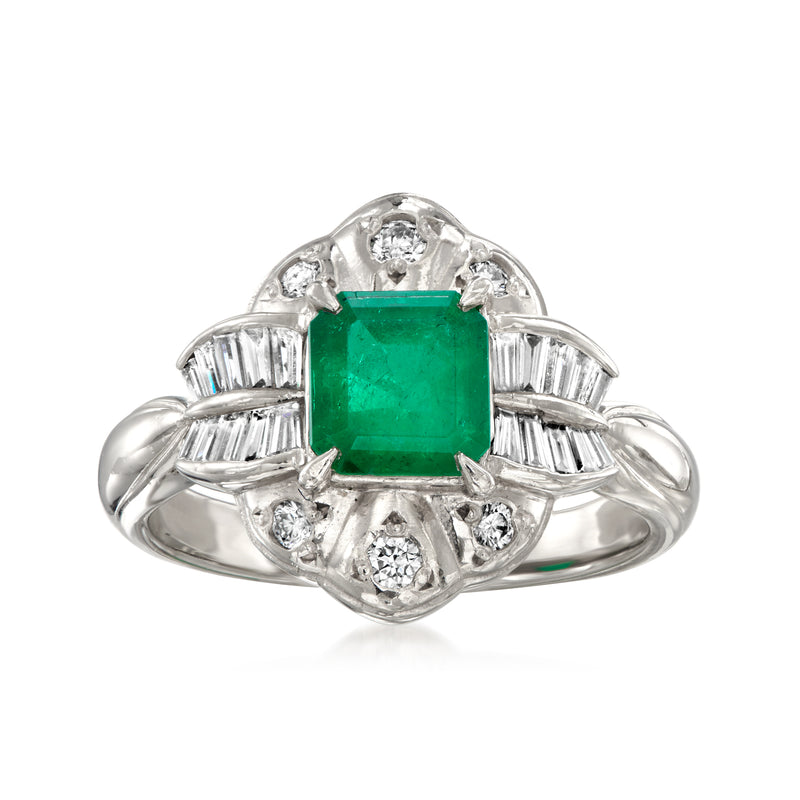 Platinum vintage ring with emerald-cut green emerald center, diamond halo and baguettes