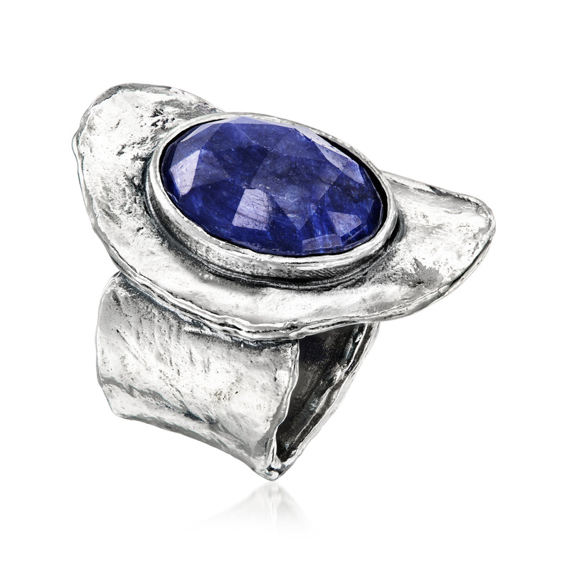 Blue oval sapphire ring with halo border and textured sterling silver band