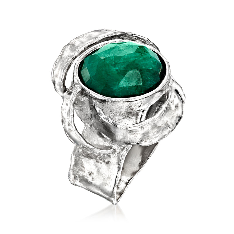 Sterling silver ring with oval green gemstone, raised bezel, and openwork design