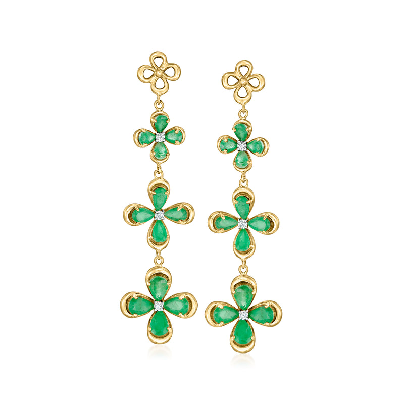 Gold drop earrings with emerald-green floral clusters and dangling cross-shaped drops