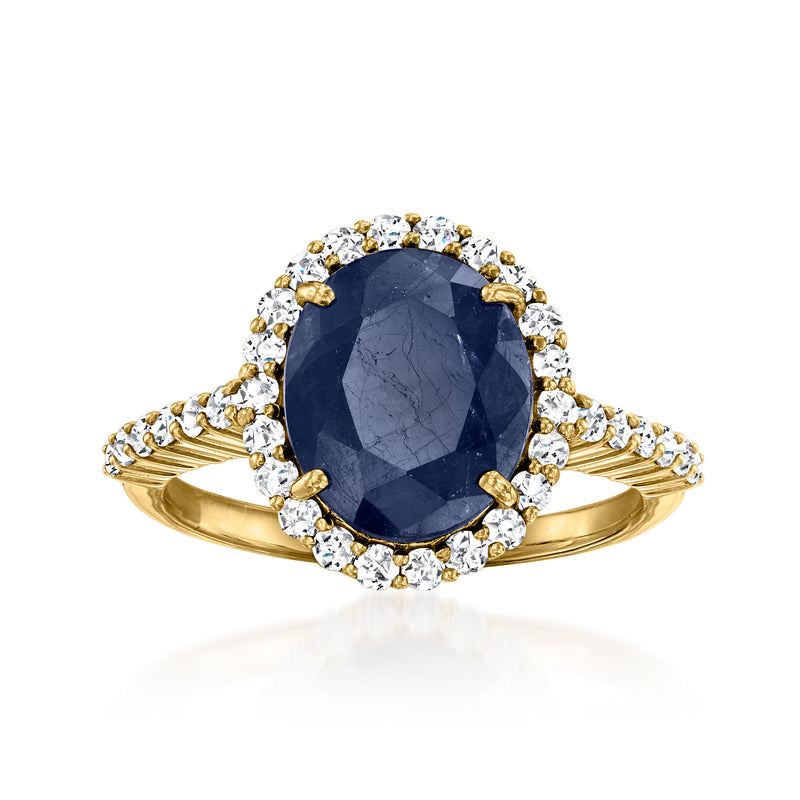 18kt yellow gold ring with oval sapphire and diamond halo