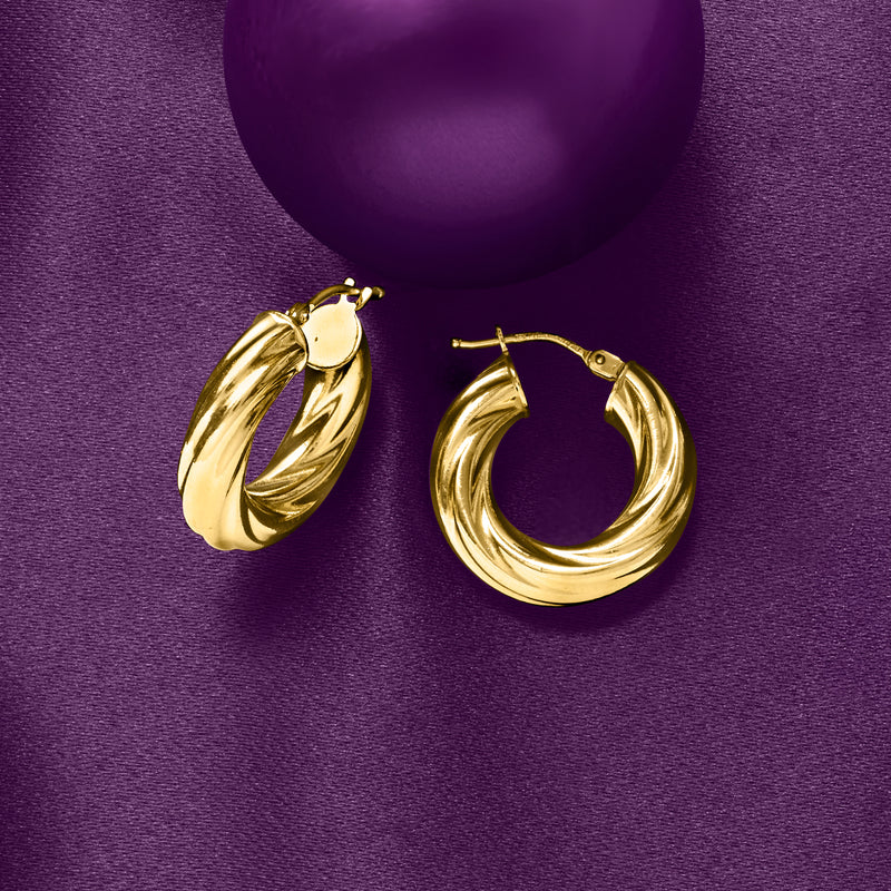 Twisted yellow gold hoop earrings with ridged twist detail, front view