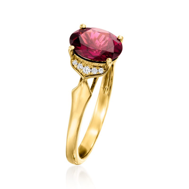14kt yellow gold rhodolite garnet ring with oval center stone and diamond band detail