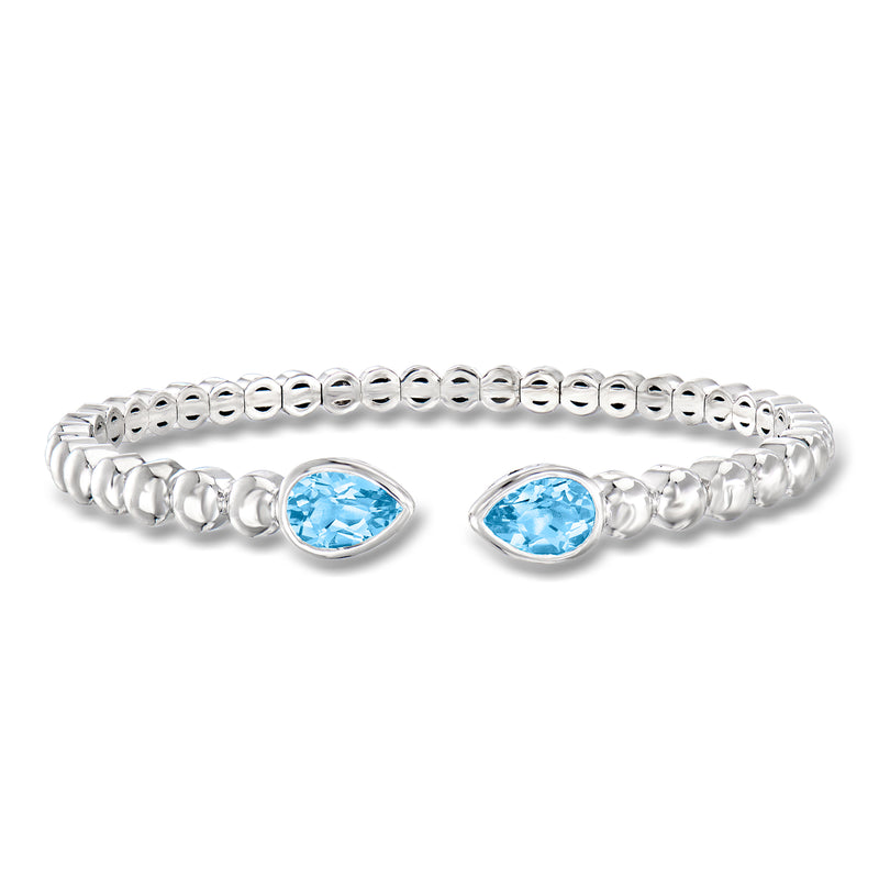 Sterling silver cuff bracelet with two blue oval gemstones in hinged link setting