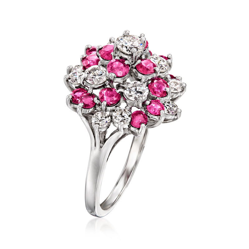 White gold swirl ring with pink ruby stones and sparkling diamonds, side view