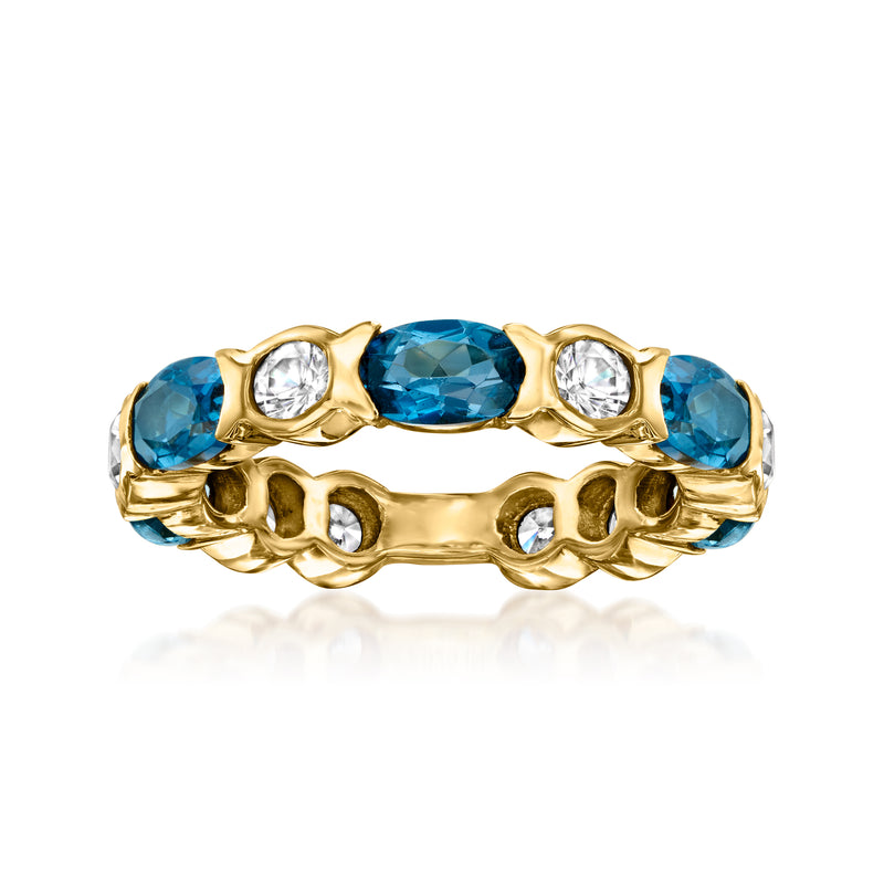 Gold eternity band with London blue oval topaz and white zircon accents, visible stones