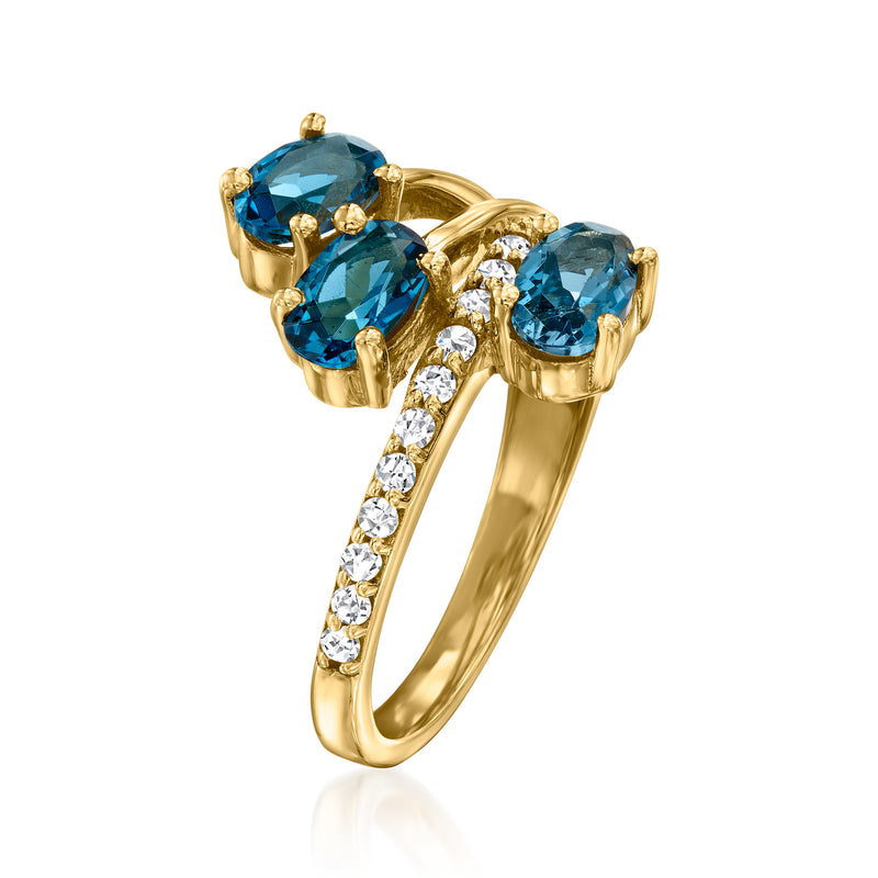 Gold over sterling ring with three blue topaz stones and white zircon row