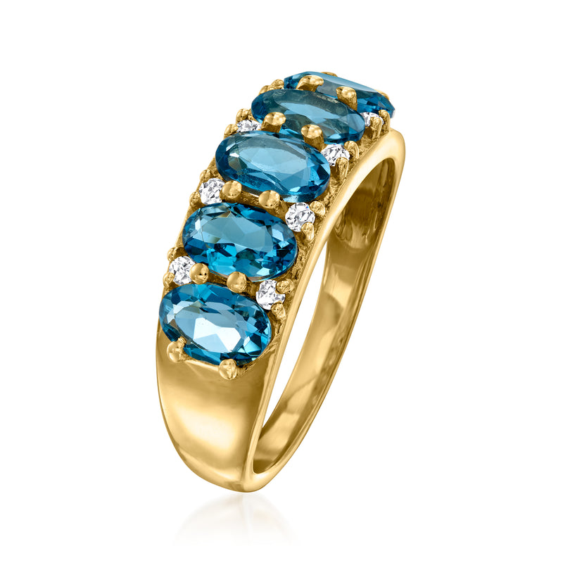 Gold ring profile with five blue topaz stones and small white zircon highlights