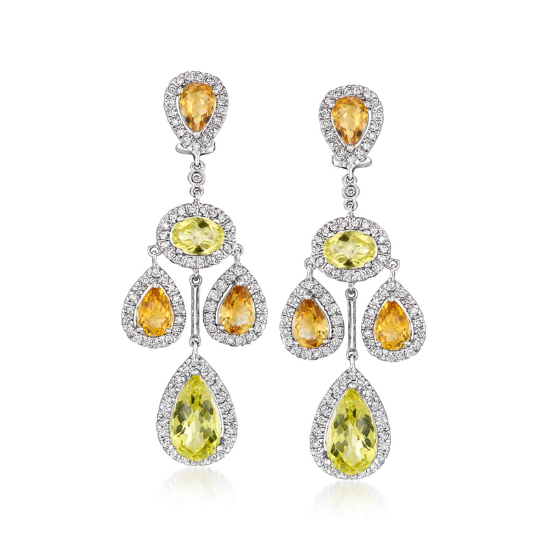 Chandelier earrings in 14kt white gold with pear-cut yellow gemstones and diamond halos.