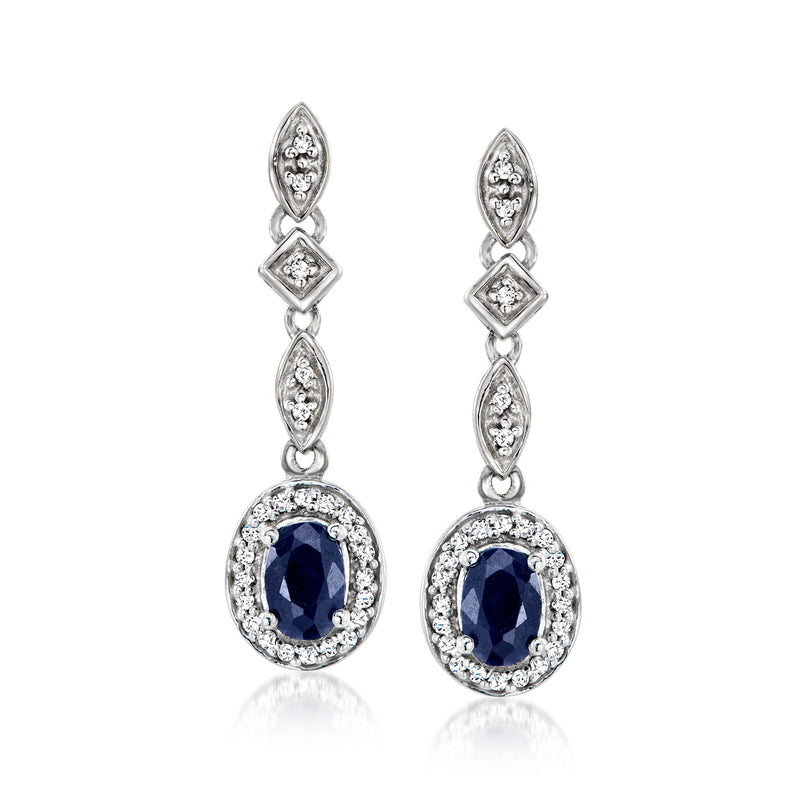 Sterling silver drop earrings with oval blue sapphire and diamond halo details