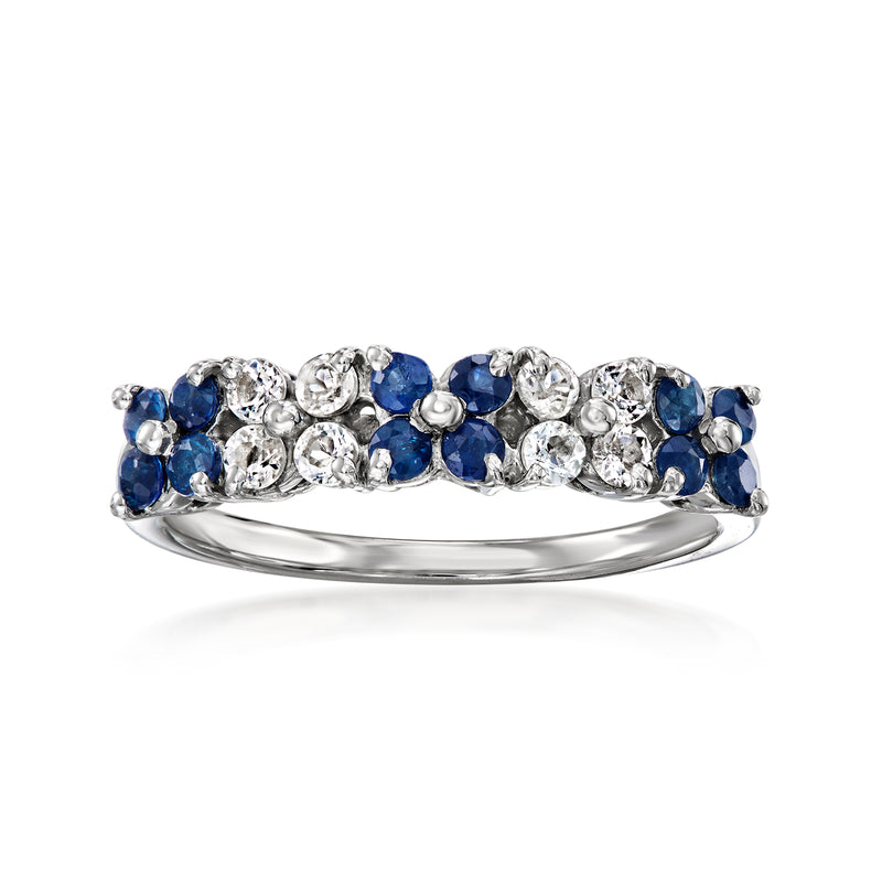 Sterling silver floral ring with blue sapphires and white gemstones, side view