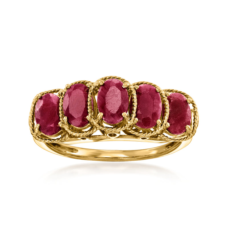 Gold five-stone ring with five oval ruby gemstones, prong-set on a curved band