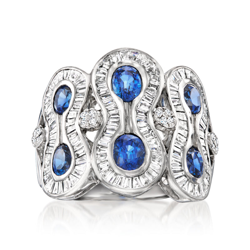 18kt white gold loop ring with oval blue sapphires and diamond accents