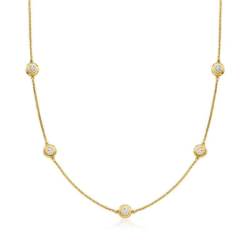 14kt yellow gold station necklace with round bezel-set diamonds along the chain