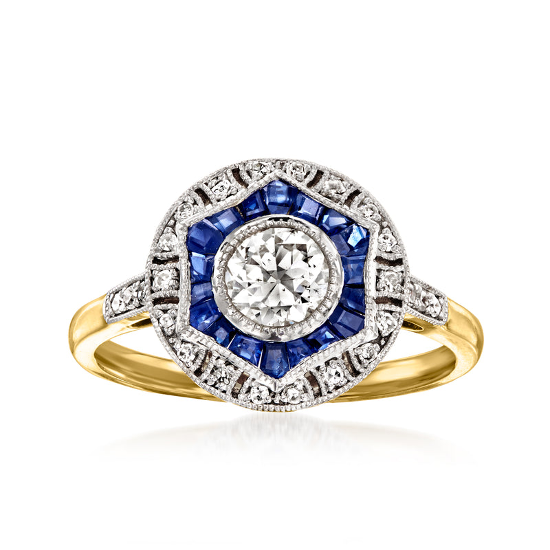 14kt yellow gold ring with central round diamond, blue sapphire halo, and diamond band