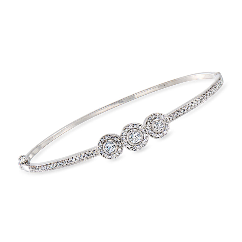 White gold diamond cluster bangle bracelet with round stones and pave accents