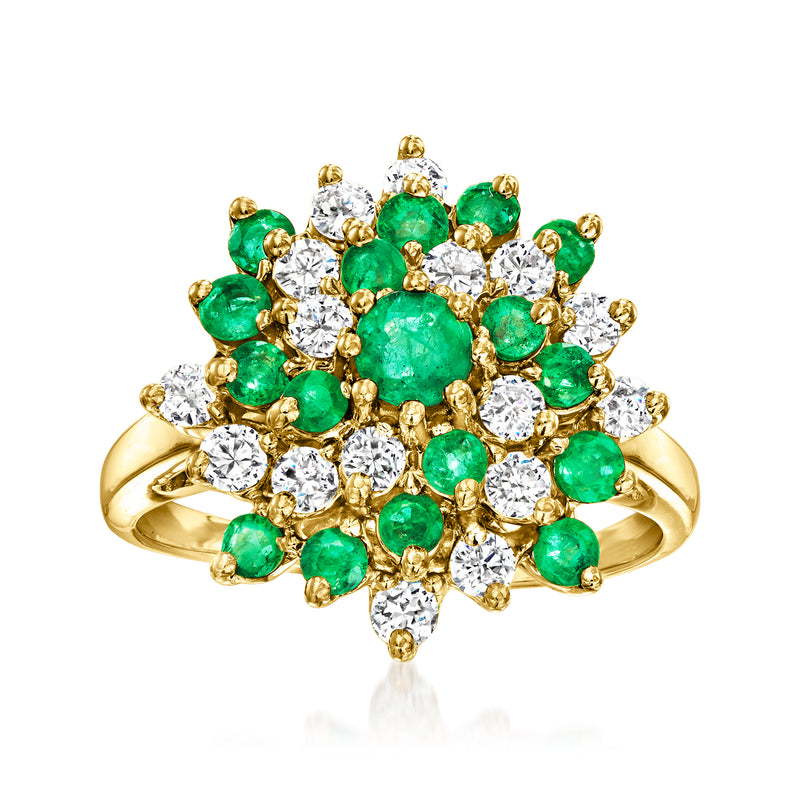 Vintage swirl ring in 14kt yellow gold with green emerald stones and white diamond accents