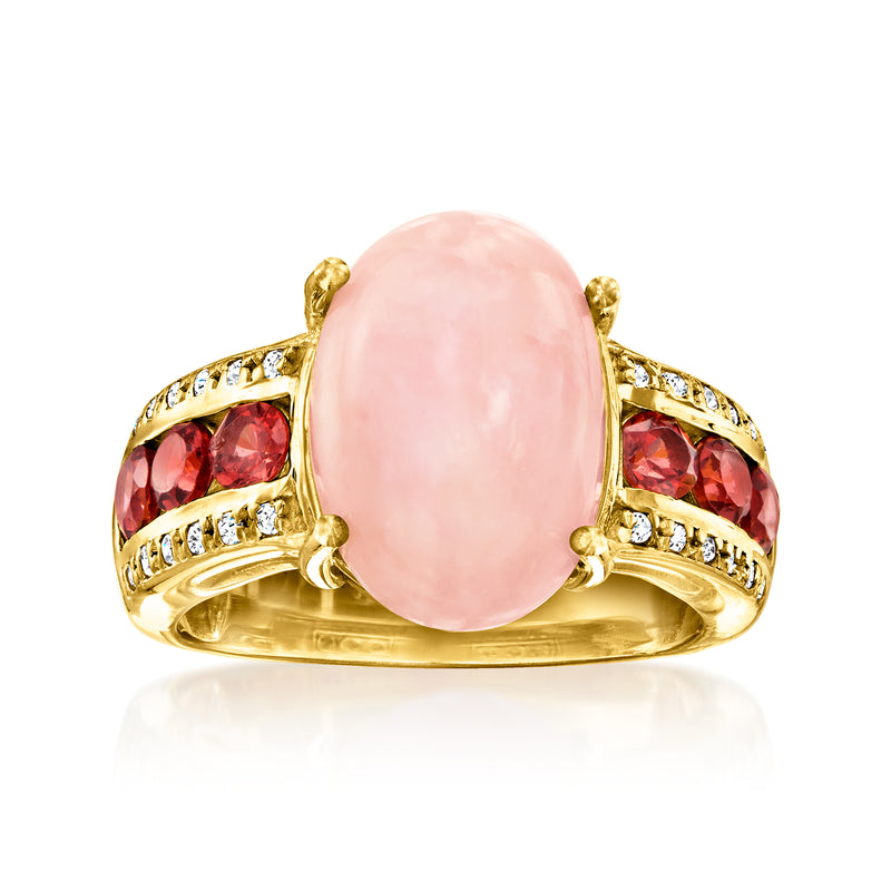 Gold ring with oval pink opal, red garnet stones, white topaz accents