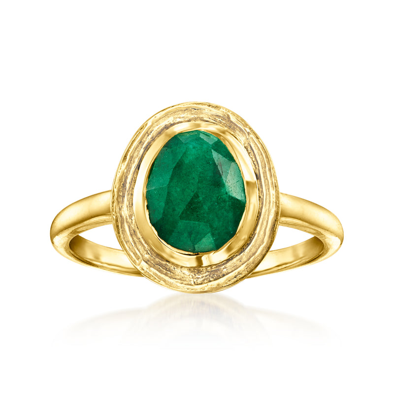 Emerald oval gemstone ring in gold-toned setting with double halo detail
