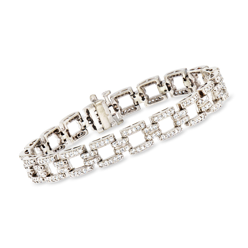 White gold diamond link bracelet with rectangular settings and prong-set stones.