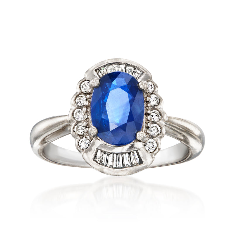Platinum ring with oval blue sapphire and diamond halo, split-shank
