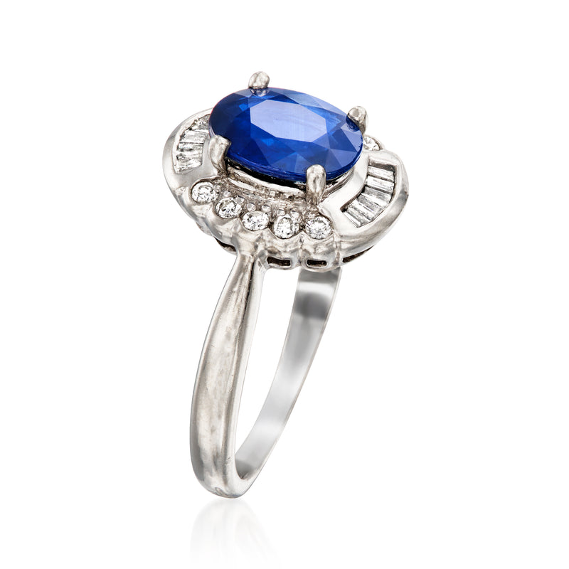 Platinum ring with large blue sapphire centerpiece and round diamond accents
