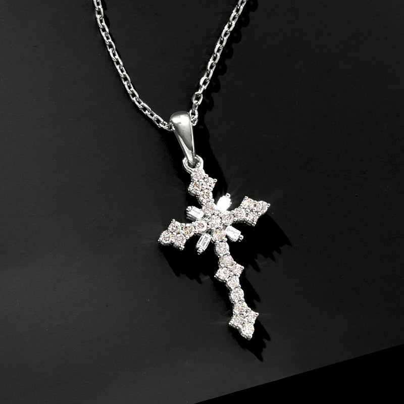 Sterling silver diamond cross pendant necklace, close-up of gemstone cross on chain