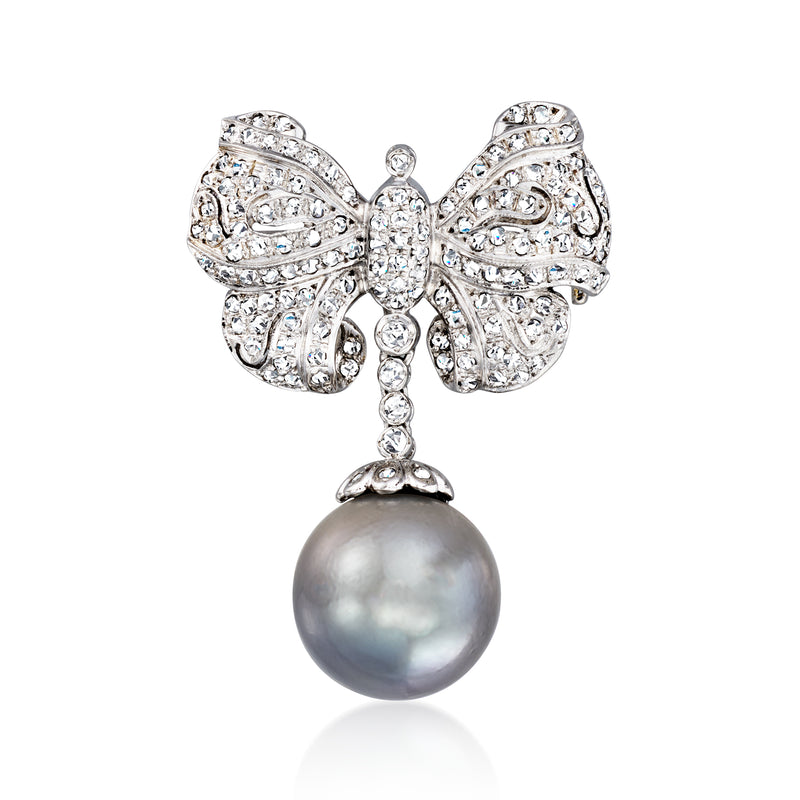White gold bow pin with diamond settings and gray cultured pearl drop