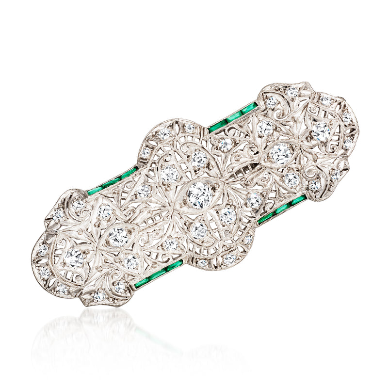 Platinum filigree diamond pin/pendant with green emerald accents, bar centerpiece