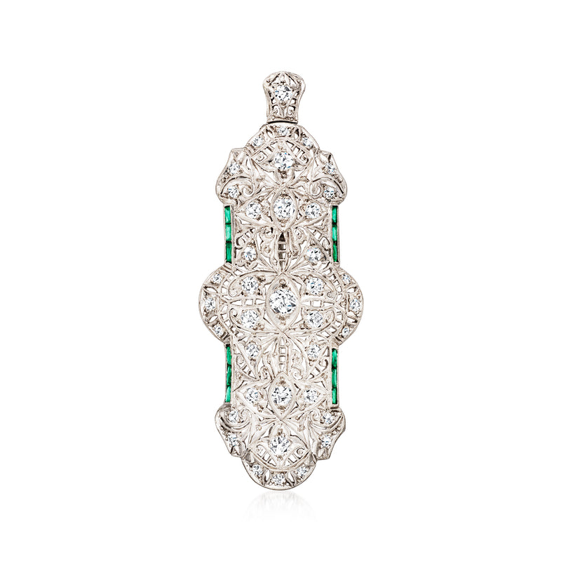 Platinum filigree diamond pin/pendant with tall green emerald accents and ornate setting