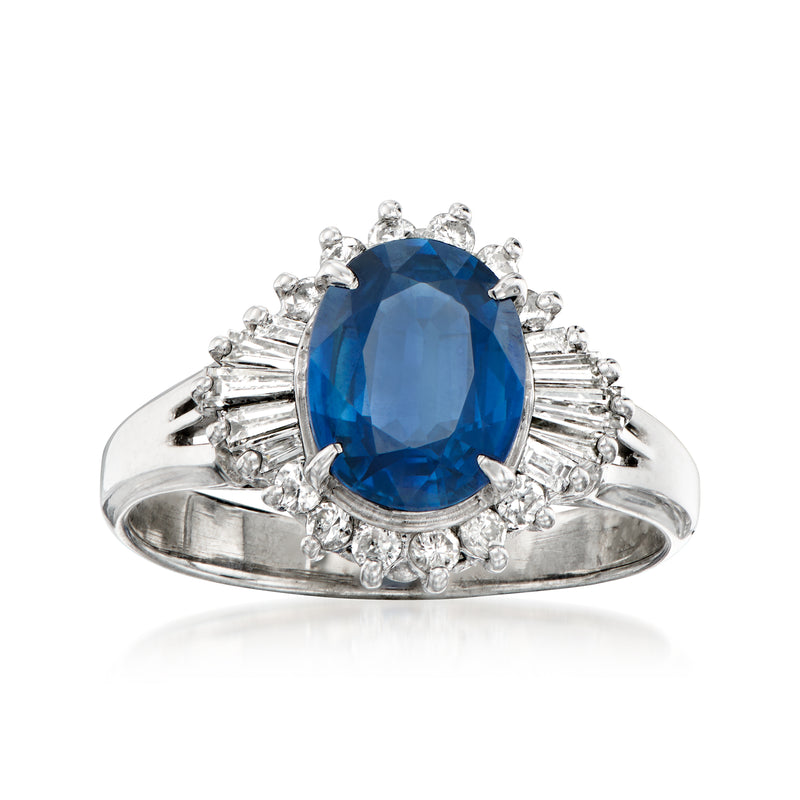 Platinum ring with oval blue sapphire and diamond halo, prong-set center