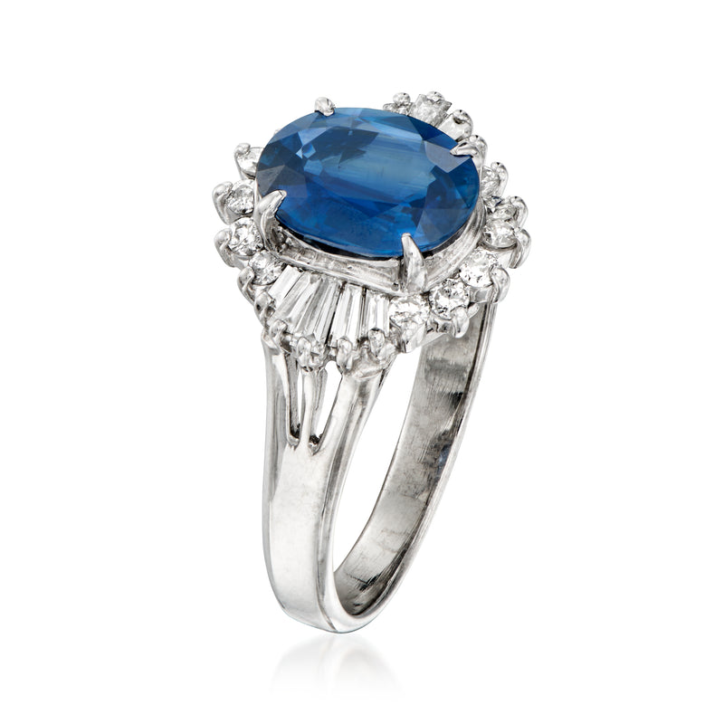 Platinum ring with side view oval blue sapphire and diamond halo, prong-set