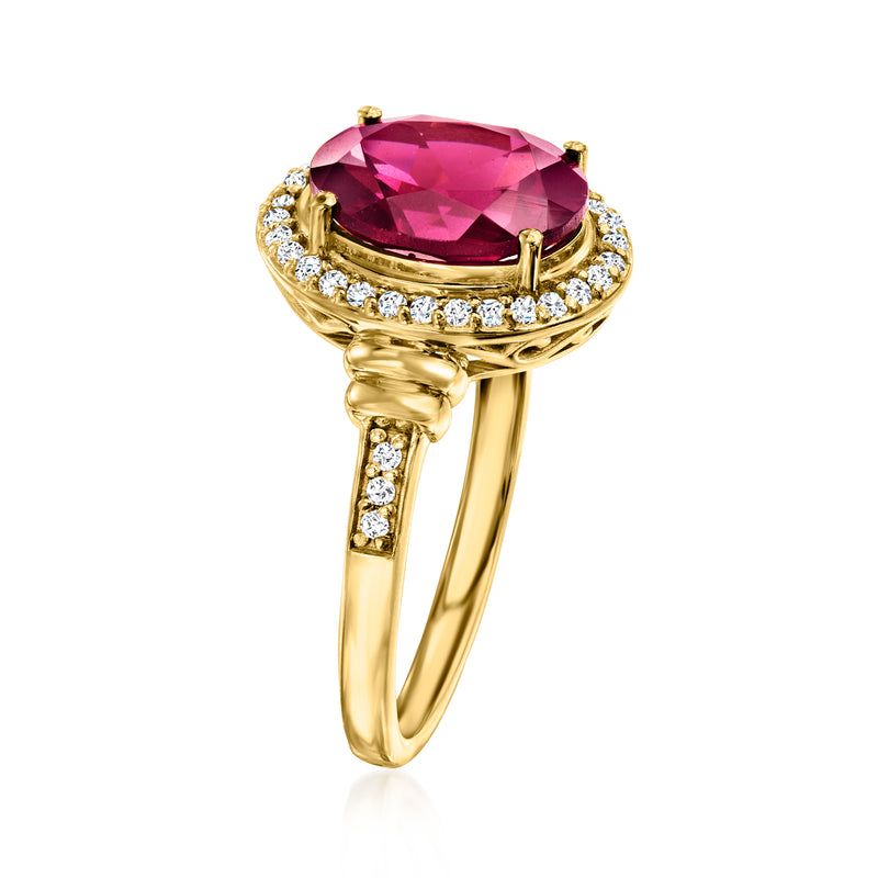 Gold over sterling ring with oval red gemstone, prong settings, and white stone band