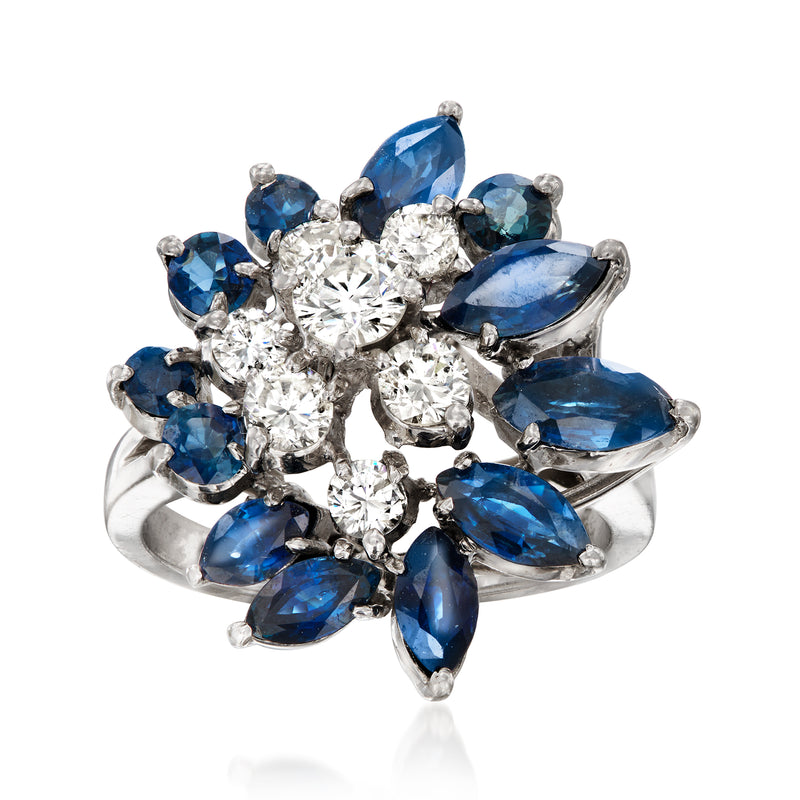 14kt white gold cluster ring with round diamonds and blue oval sapphire stones