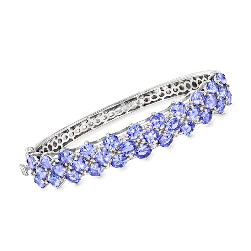 Sterling silver bangle bracelet with blue oval faceted tanzanite stones in a row