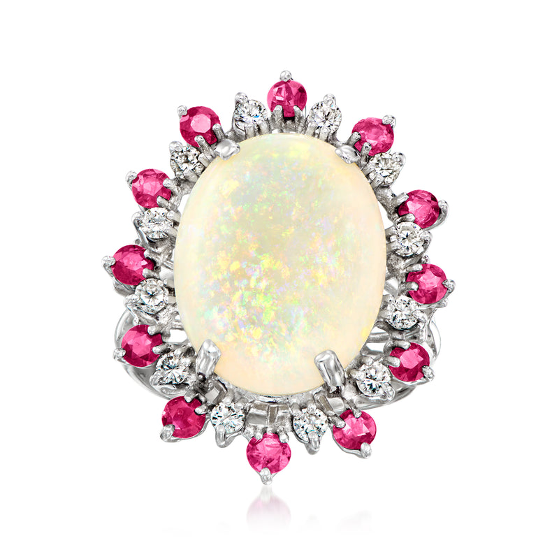 Vintage white gold cocktail ring with oval opal center, pink ruby halo and diamond accents