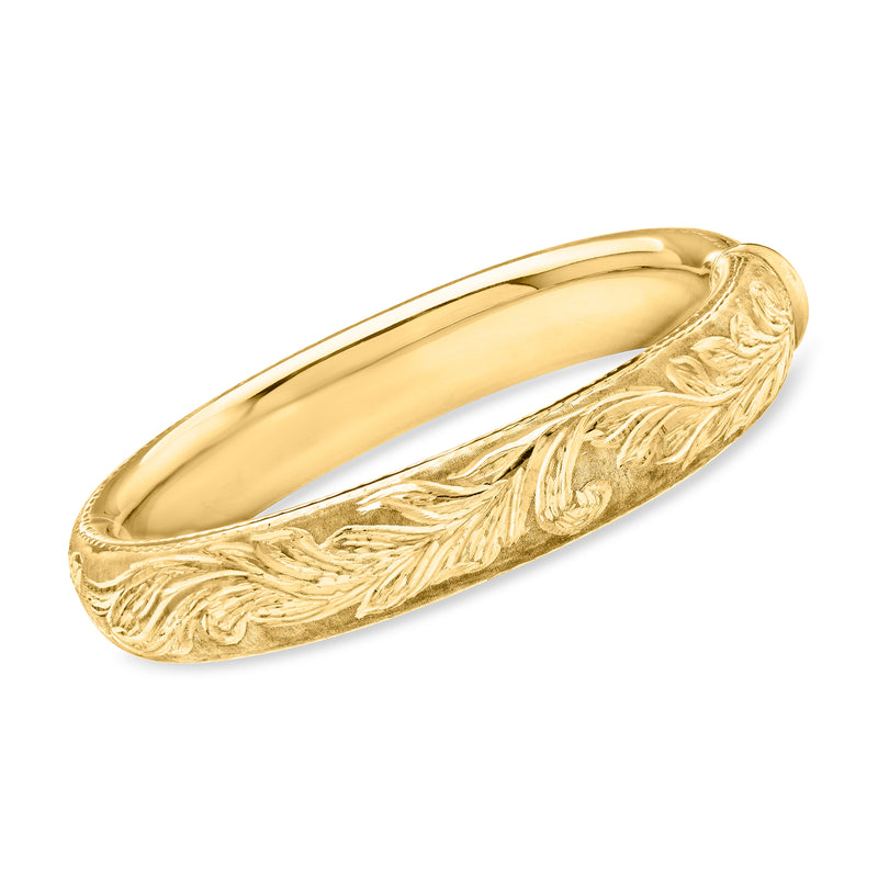 Yellow gold bangle bracelet with raised leaf-like Florentine engraving